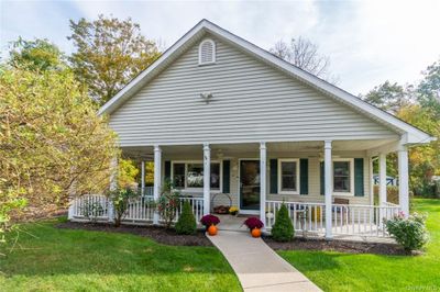 View of front of house featuring a porch and a front yard | Image 1