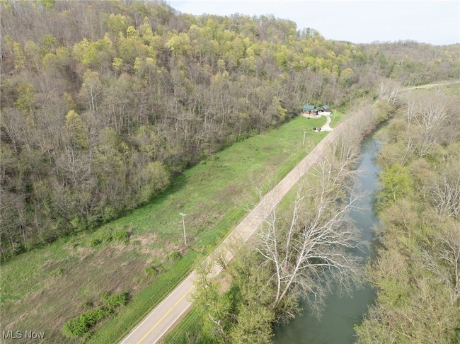 Birds eye view of property featuring a water view and a forest view | Image 32