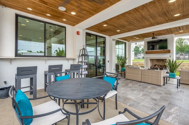 Patio of the club house with fireplace | Image 34