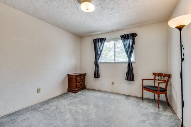 Secondary bedroom with walk-in closet. | Image 16
