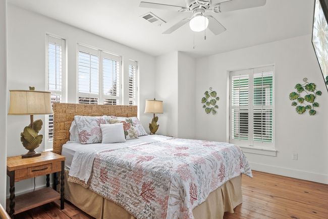 Spacious Primary bedroom with beautiful plantation shutters and a ton of natural light! | Image 13