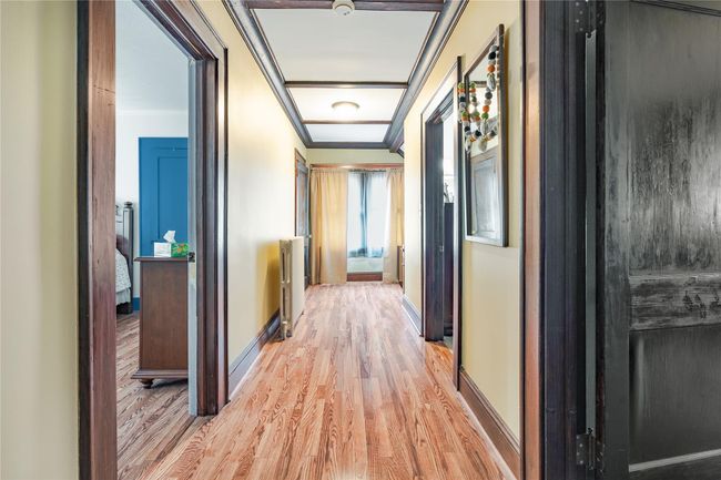Upstairs Hallway - featuring light wood finished floors, baseboards, and ornamental molding | Image 19