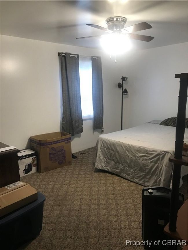 Carpeted bedroom featuring ceiling fan | Image 12