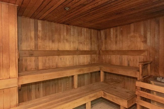 Relaxing sauna featuring wooden walls and wood ceiling | Image 22