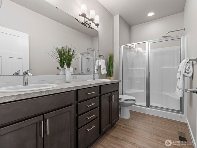 There's plenty of room to get ready for the day in the ensuite 3/4 bathroom with walk in shower. | Image 17