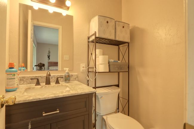 Bathroom with toilet and vanity | Image 38