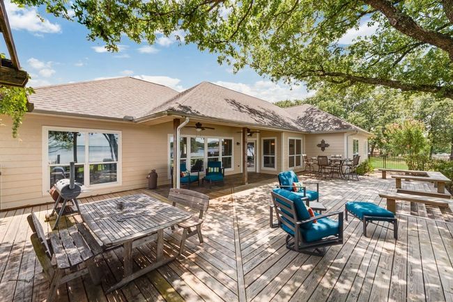 With an expansive deck shaded with mature trees...the perfect space to BBQ and entertain! | Image 4