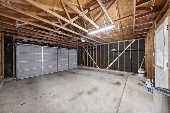 Garage with a garage door opener | Image 38