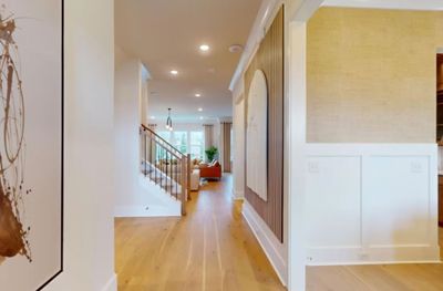 A grand foyer-pass by your formal dining room w/ a pass through butlers pantry and your private study as you enter into your large gathering room just off the kitchen. This picture is for representation only. | Image 3