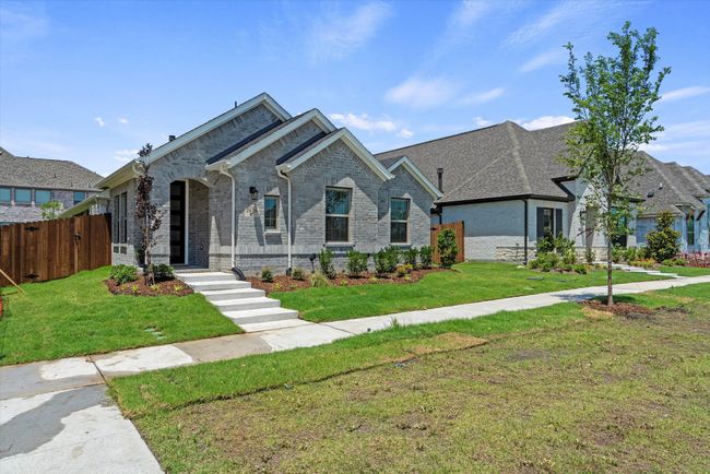 View of front of home featuring brick siding. | Image 4