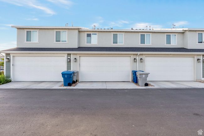 View of front of house featuring a garage and stucco siding | Image 15