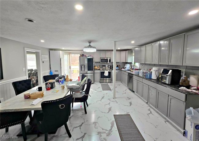 Dining space featuring recessed lighting, marble finish floor, and a textured ceiling | Image 19
