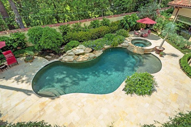 Aerial view of the backyard pool and extensive gardens. | Image 48