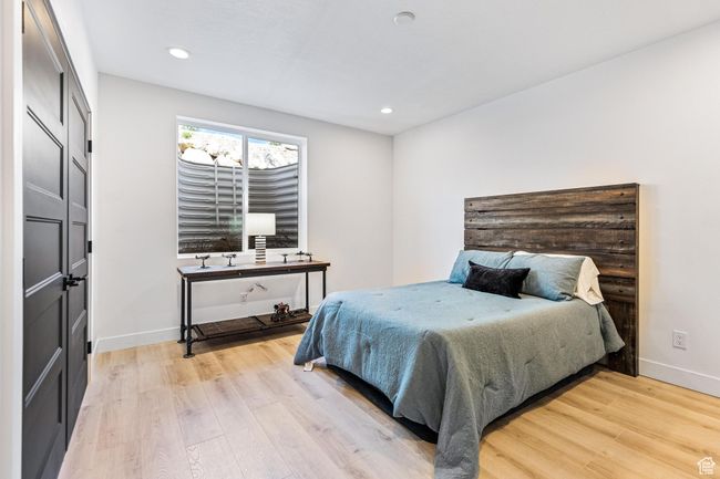 Bedroom featuring recessed lighting, light wood-style floors, and baseboards | Image 29