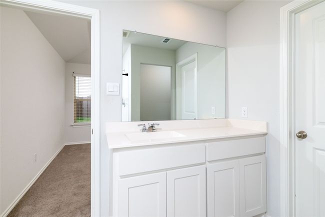 Bathroom featuring vanity and baseboards | Image 25