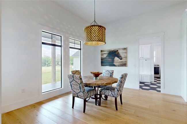 Breakfast area featuring light wood-type flooring and baseboards | Image 10