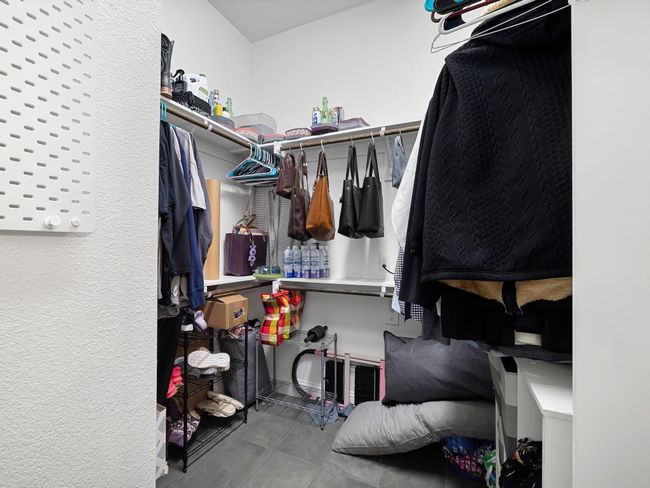 Spacious closet featuring tile patterned floors | Image 24