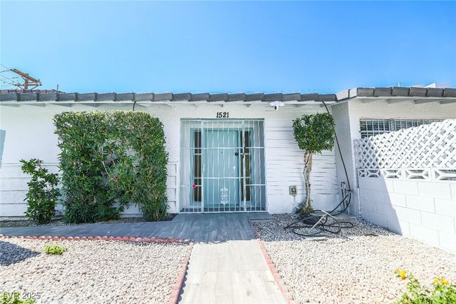 Entrance to property featuring stucco siding | Image 5
