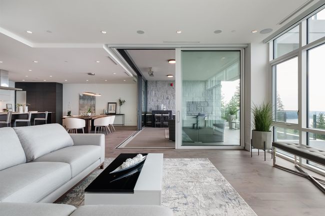 Building lobby featuring recessed lighting and a wall of windows | Image 11