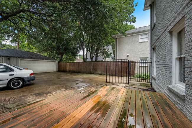 Wooden deck with an outbuilding and a garage | Image 26