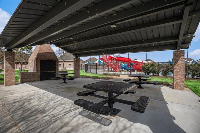 Enjoy shaded seating under the community pavilion—perfect for relaxing after a swim or enjoying the outdoors with neighbors. | Image 32