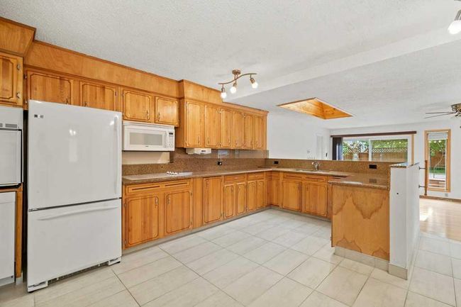 11408 Wilcox St Se, House other with 5 bedrooms, 3 bathrooms and 6 parking in Calgary AB | Image 10