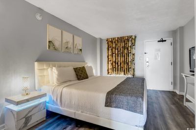 Bedroom with dark hardwood / wood-style floors | Image 2