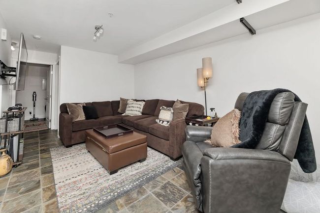 Downstairs recreation area/family room that could be converted to a third bedroom or used as a home business with separate entry | Image 29