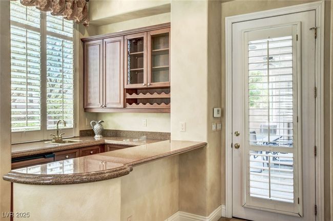 Bar with baseboards and a sink | Image 15