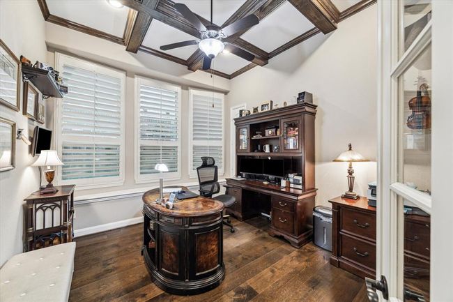 Handsome beams, plantation shutters and hard wood floors in the study which is tucked away on the first floor. | Image 13