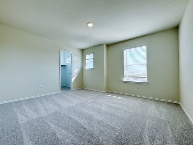 Spare room featuring light colored carpet and baseboards | Image 22