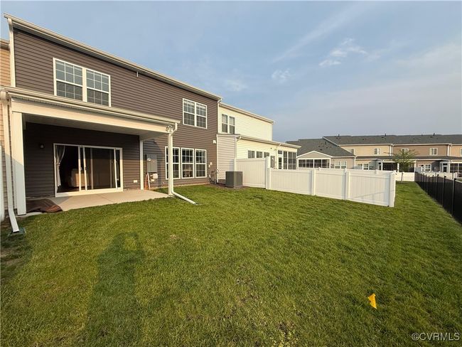 Back of property featuring central AC unit and a patio area | Image 20