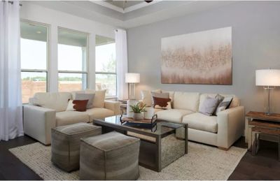 Photo of Pulte model home with same floor plan, not of actual home listed. | Image 3