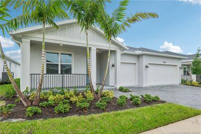 6398 Nw Sweetwood Drive, House other with 3 bedrooms, 2 bathrooms and 3 parking in Port Saint Lucie FL | Image 3