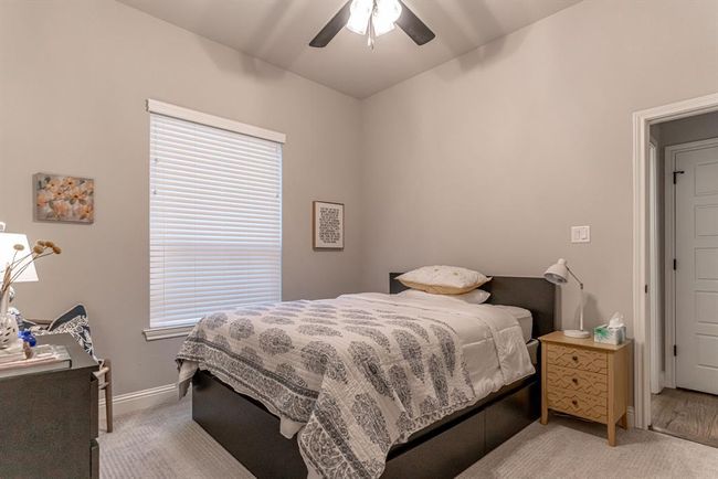 Bedroom with carpet flooring and ceiling fan | Image 27