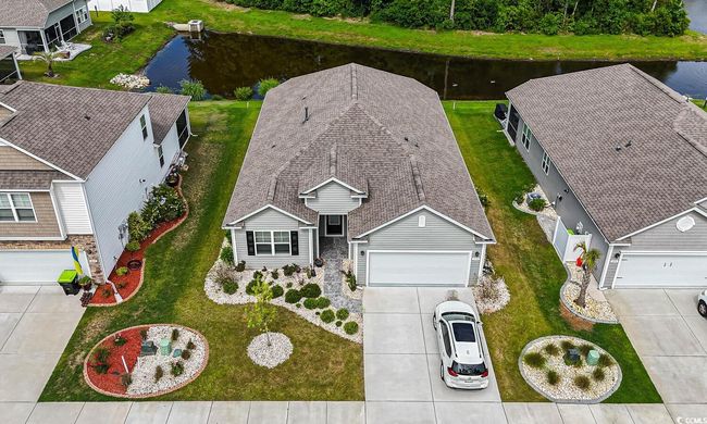 View from above of property with a nearby body of water | Image 7