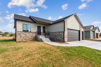 View of front of home featuring a garage and a front lawn | Image 2