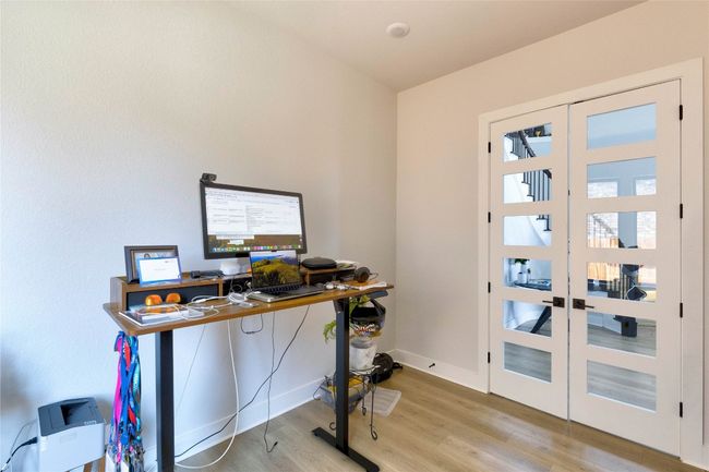 Office area with baseboards, wood finished floors, and french doors | Image 6
