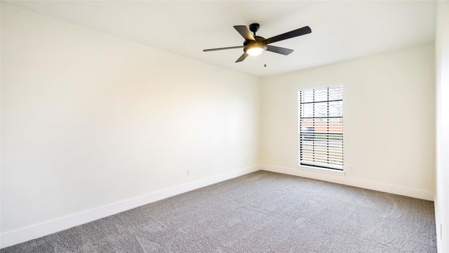 Empty room featuring carpet, baseboards, and a ceiling fan | Image 26