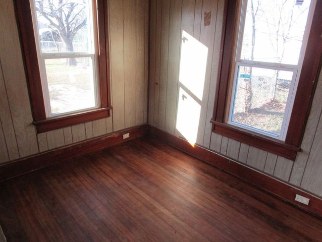 Spare room with wooden walls and dark wood-style flooring | Image 19