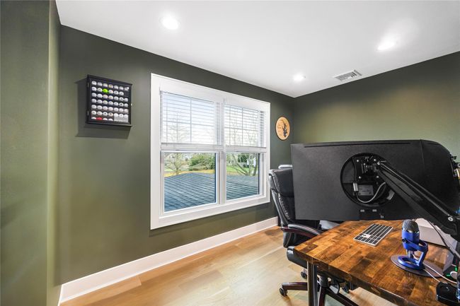 Office space with baseboards, recessed lighting, visible vents, and light wood-style floors | Image 35