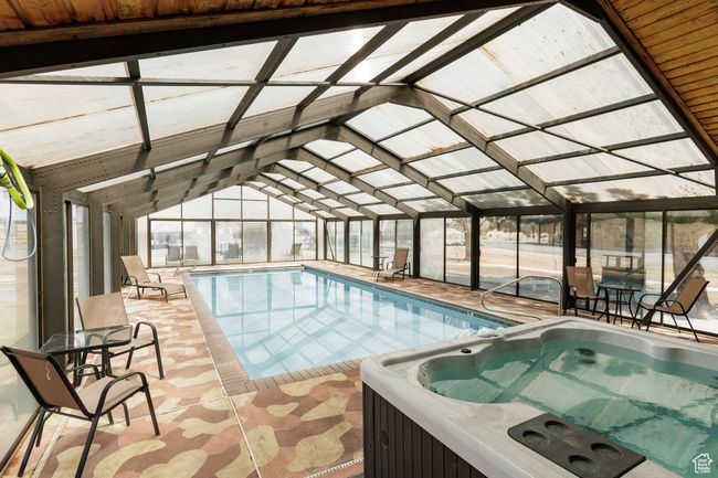 View of indoor heated pool | Image 10