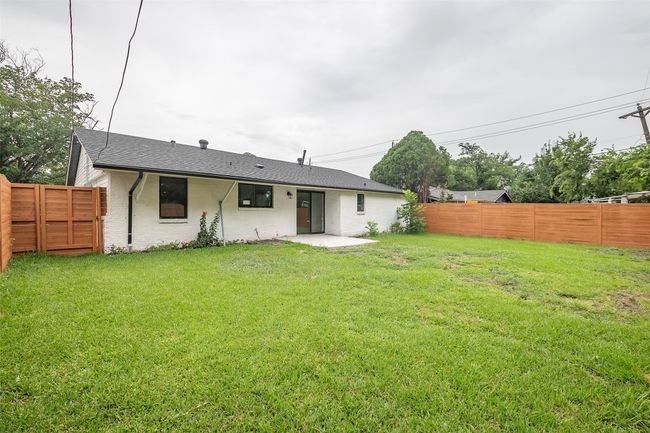 Back of property with a fenced backyard and a patio area | Image 25