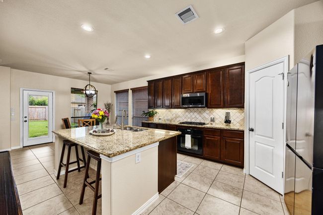 This large kitchen area is the dream for entertaining. | Image 12