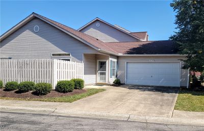 View of front of property with a garage | Image 1