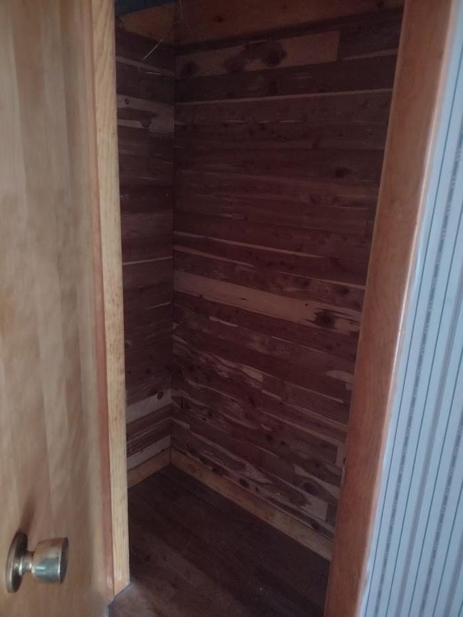 View of sauna / steam room with hardwood / wood-style floors and wood walls | Image 18