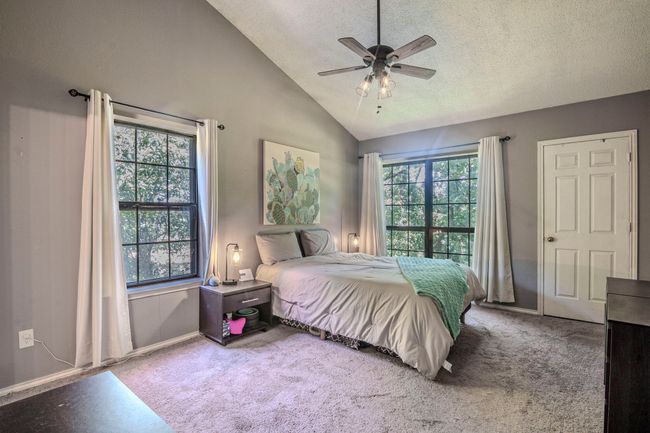Your view of the tree canopy in the primary bedroom | Image 15