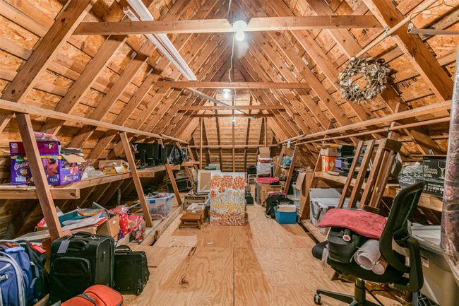 And the icing on the cake is this walk-in expansive extra storage space in the attic above the garage. | Image 39