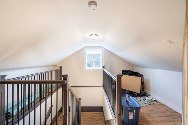 Bonus room featuring lofted ceiling, baseboards, and wood finished floors | Image 23