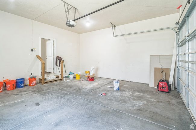 Garage featuring a garage door opener | Image 23
